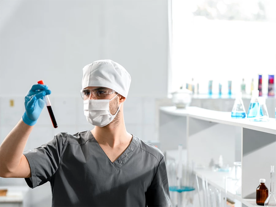 Lab technician holding test tube for CDL drug test in Sharpstown