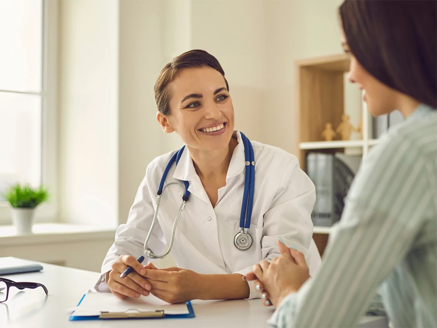 Doctor conducting commercial driver physical exam in Gulfton with patient consultation