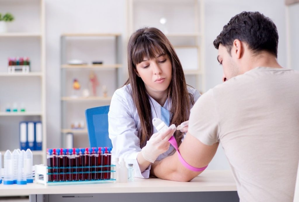 Phlebotomist draws blood samples during Best Price DOT Physical Houston exam in certified clinical setting