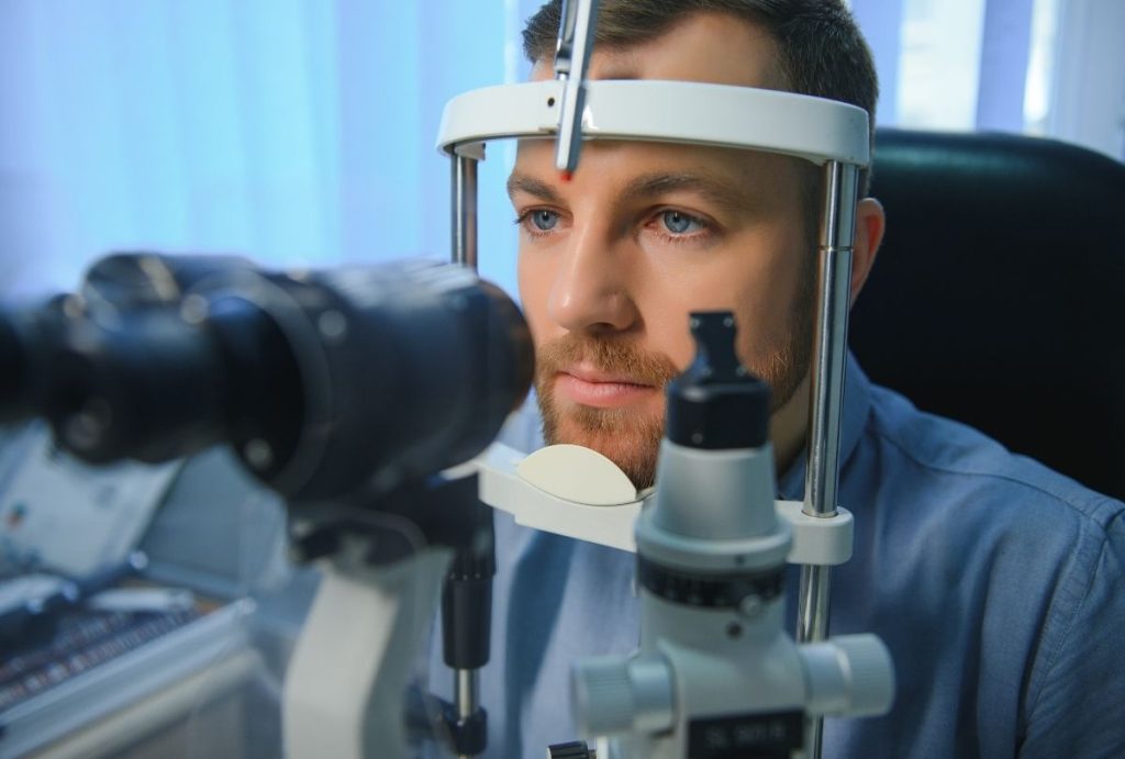 Patient receives slit lamp eye test as part of Best Price DOT Physical Houston certified medical evaluation.