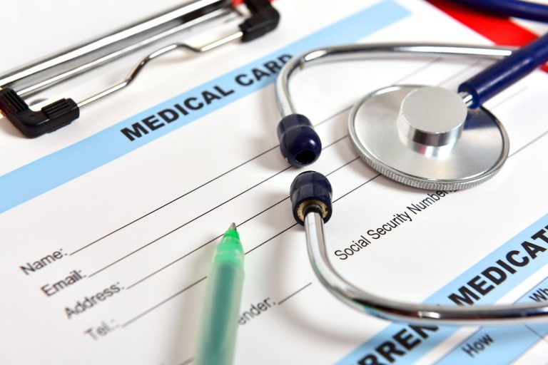 Official application form for a cdl medical card houston being completed at a DOT physical exam appointment.