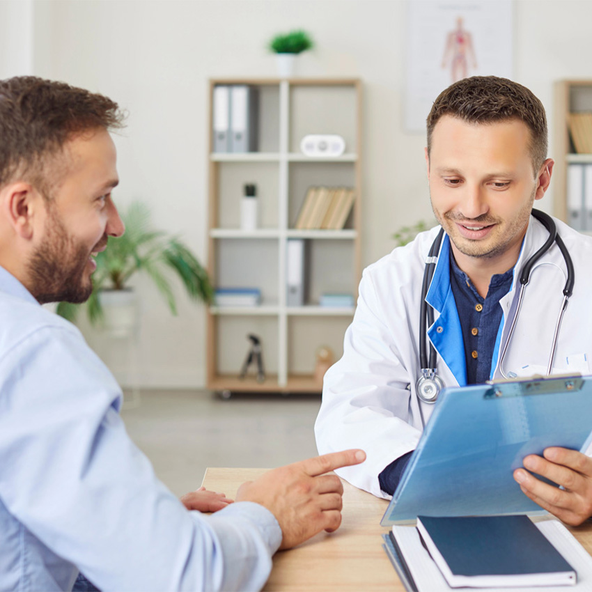 A professional doctor explains required medical results during a complete CDL DOT Physical Houston certification exam.