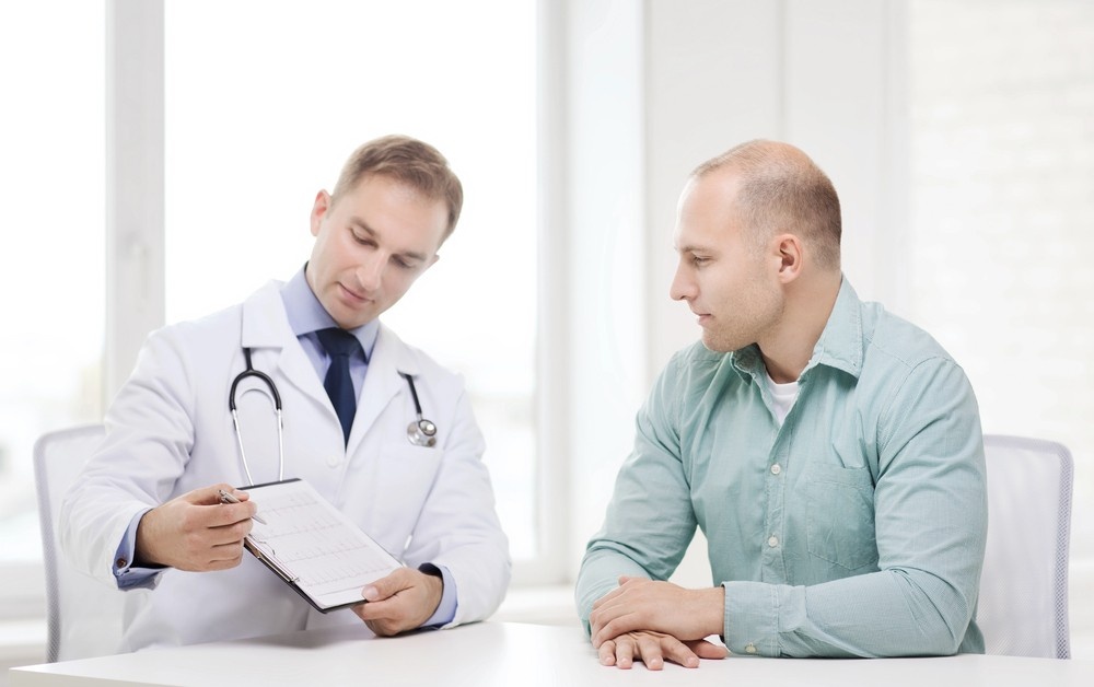A professional Houston doctor reviews official Dot drug test houston results with a patient during a consultation.