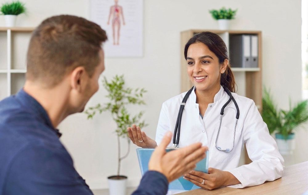 Doctor explaining the CDL physical Houston requirements to a driver during a medical consultation exam.