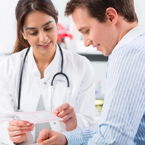Female doctor reviewing results with a patient for a DOT medical exam.